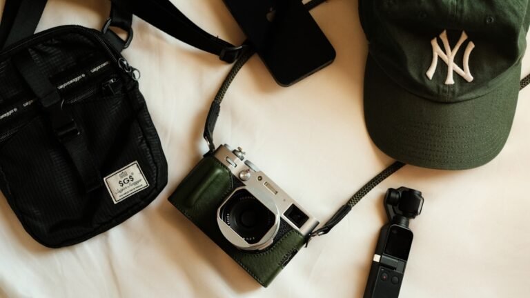 Streetwear accessories including cap, bag and jewelry laid flat