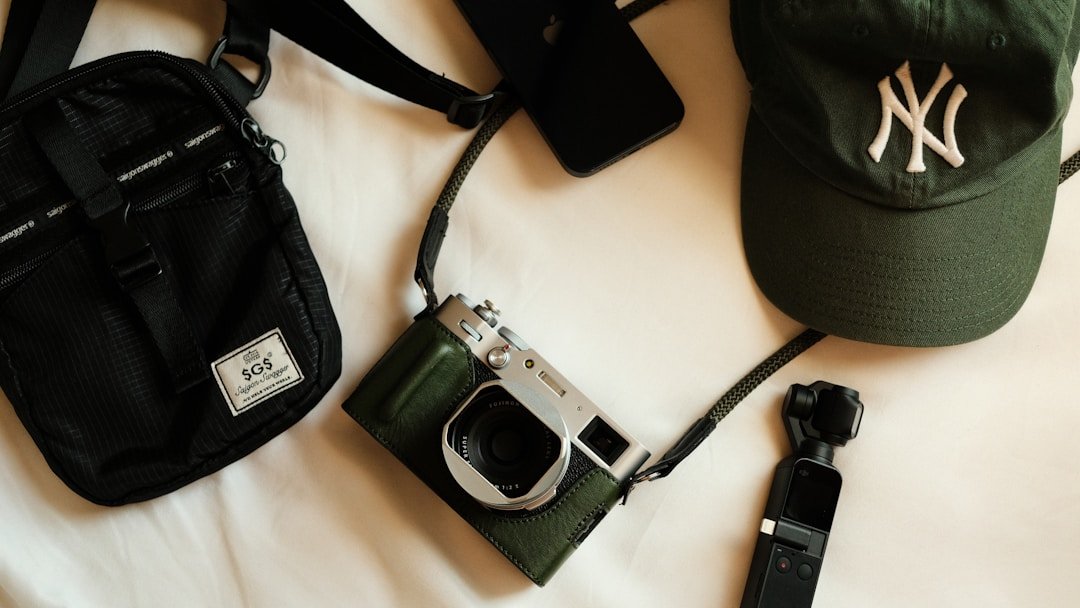 Streetwear accessories including cap, bag and jewelry laid flat