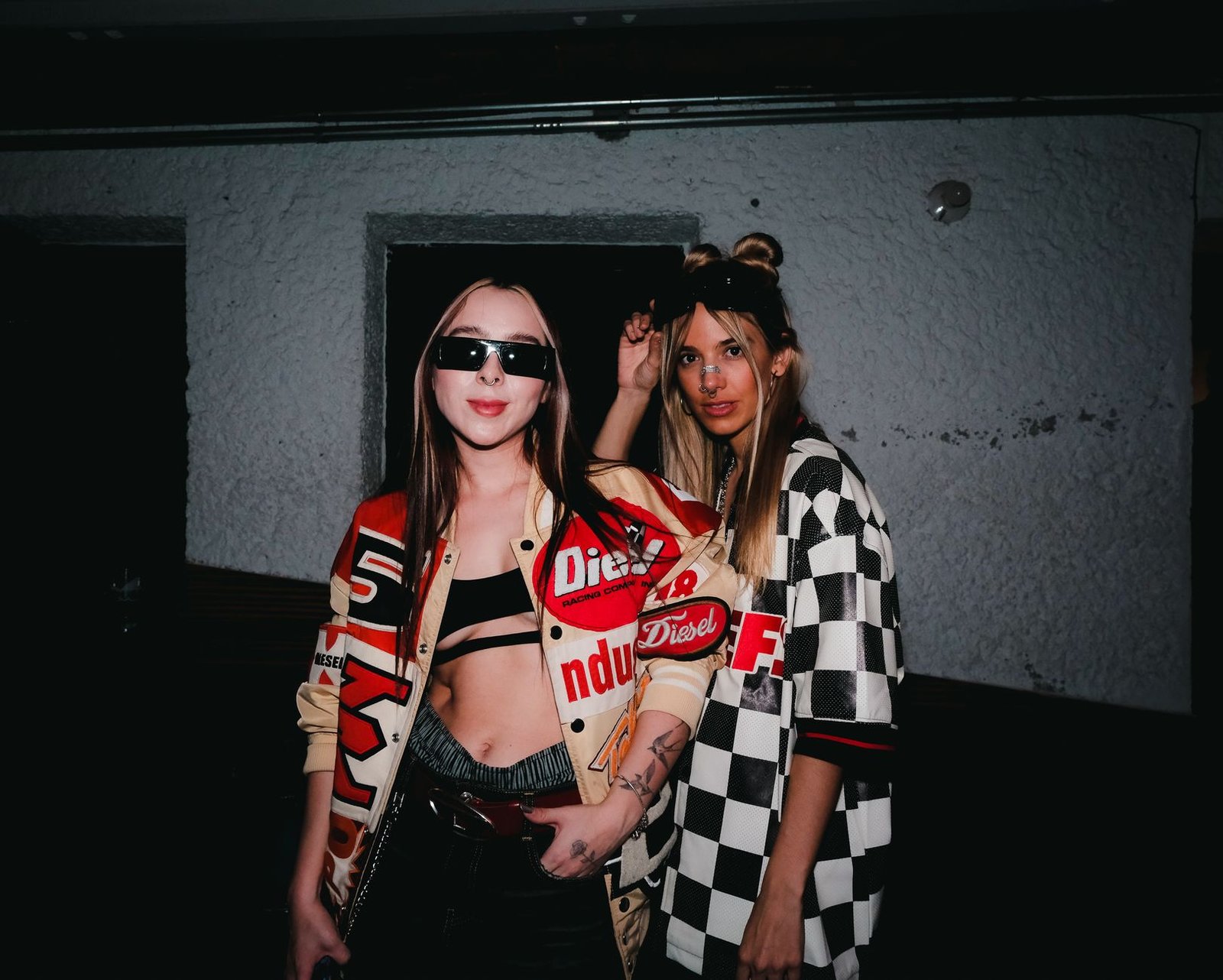 Two fashionable women posing indoors with bold streetwear in Ciudad de México.