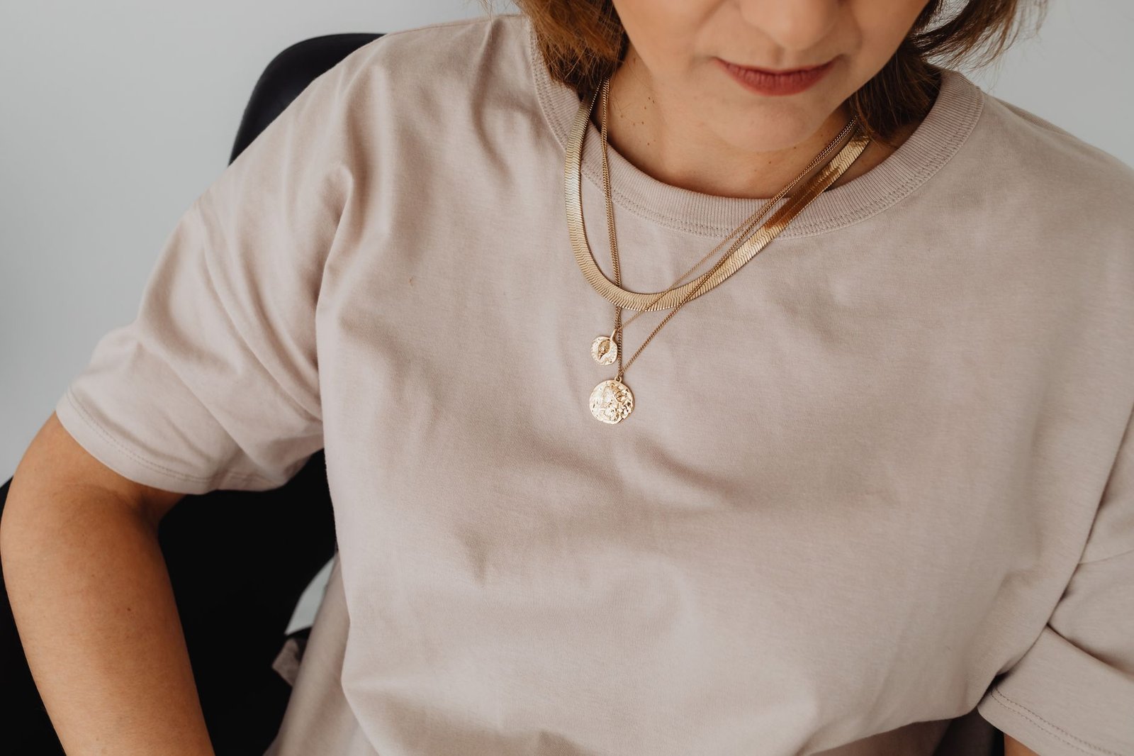 Minimal gold jewellery with neutral clean girl wardrobe