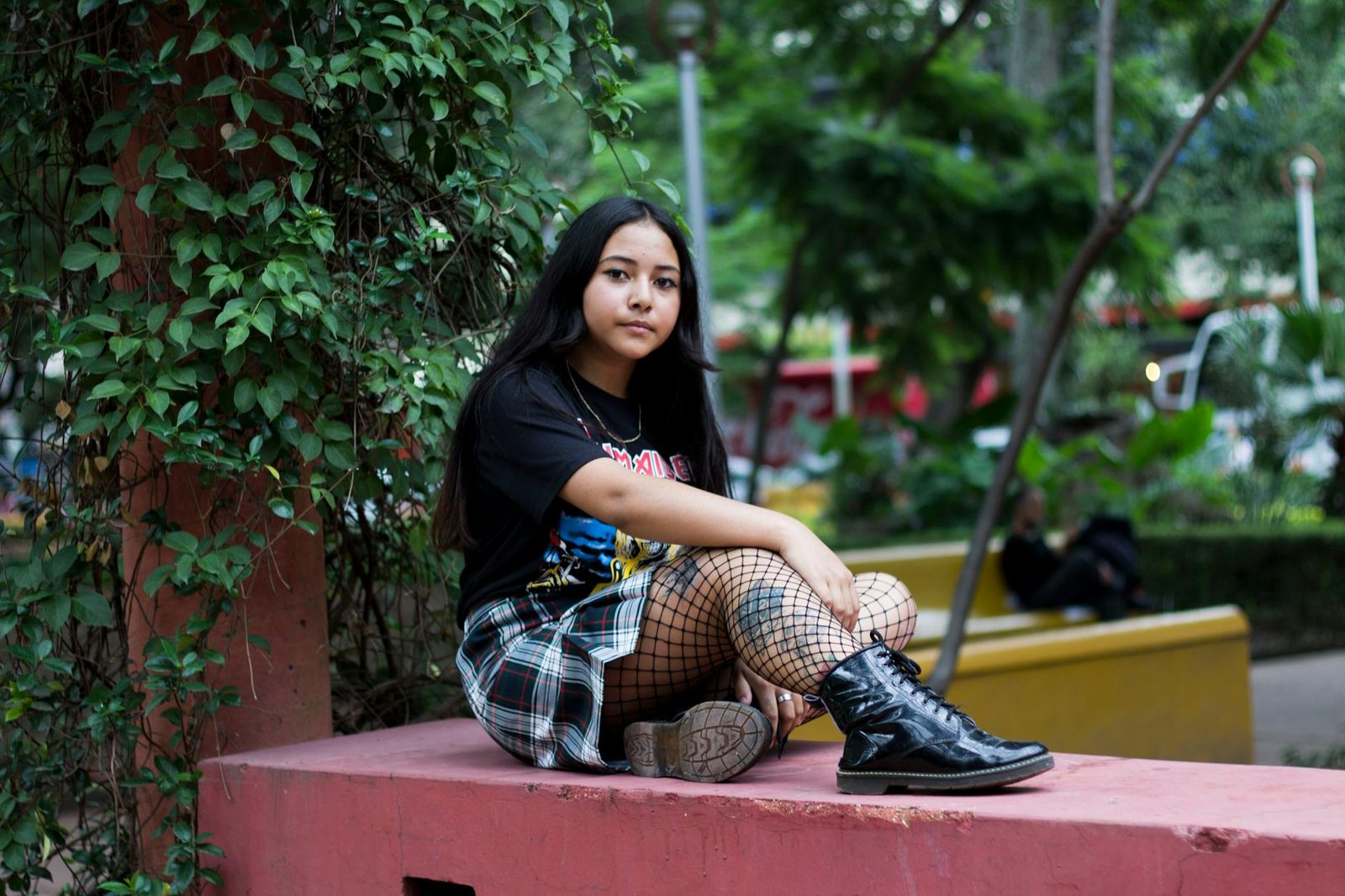 E-girl aesthetic layered tee plaid skirt and fishnet