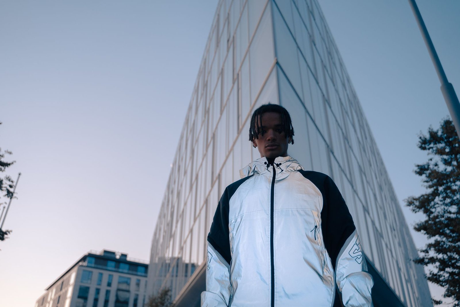 Technical outdoor jacket worn as urban streetwear