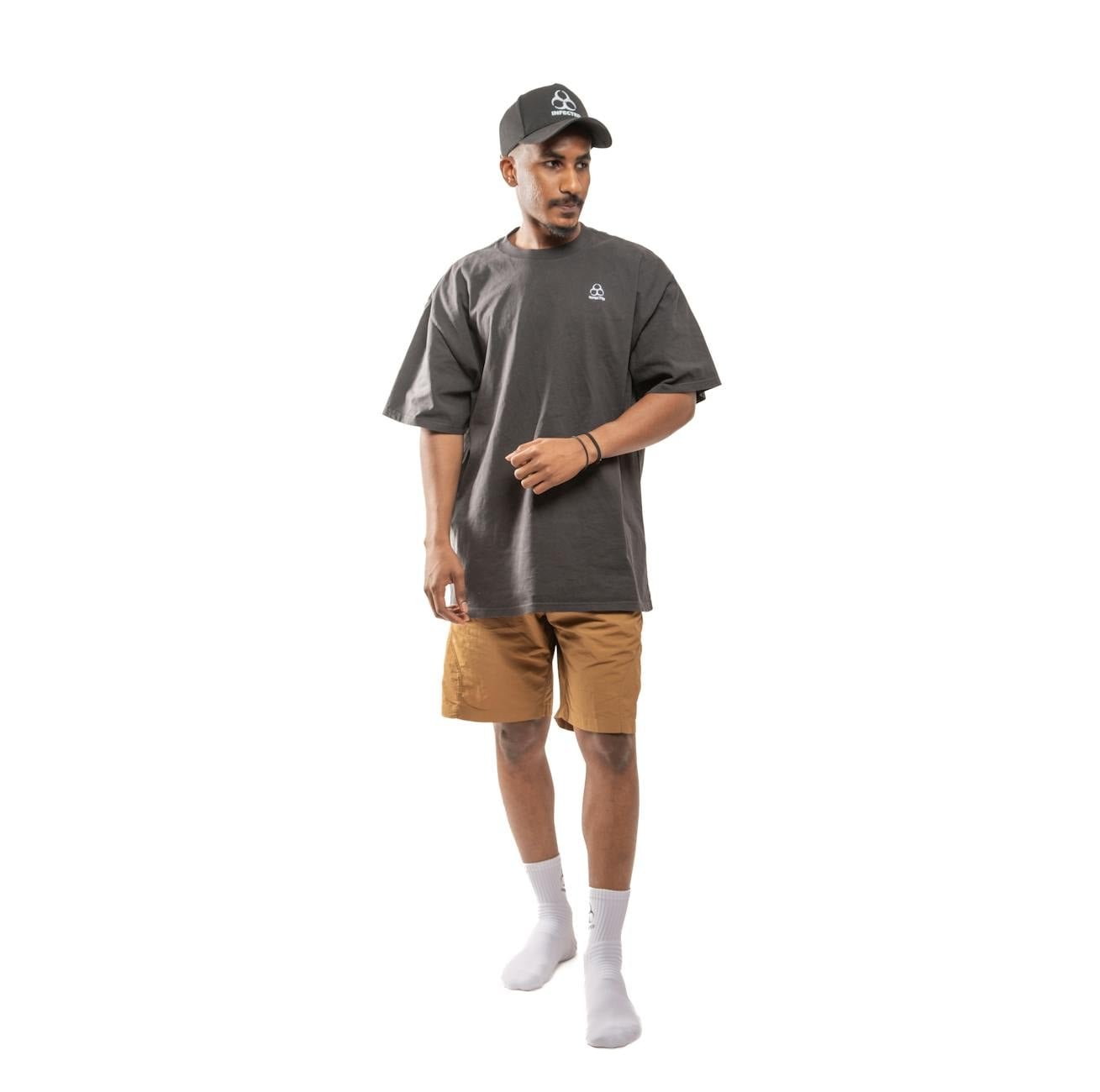 Baseball cap streetwear outfit oversized tee trainers