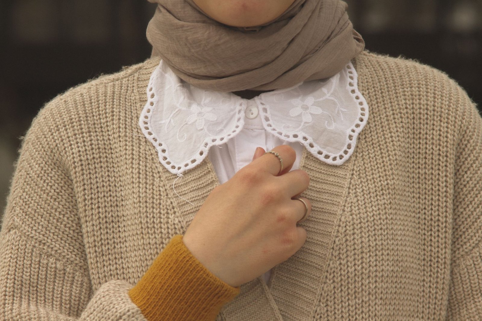 Cardigan over collared shirt academia style
