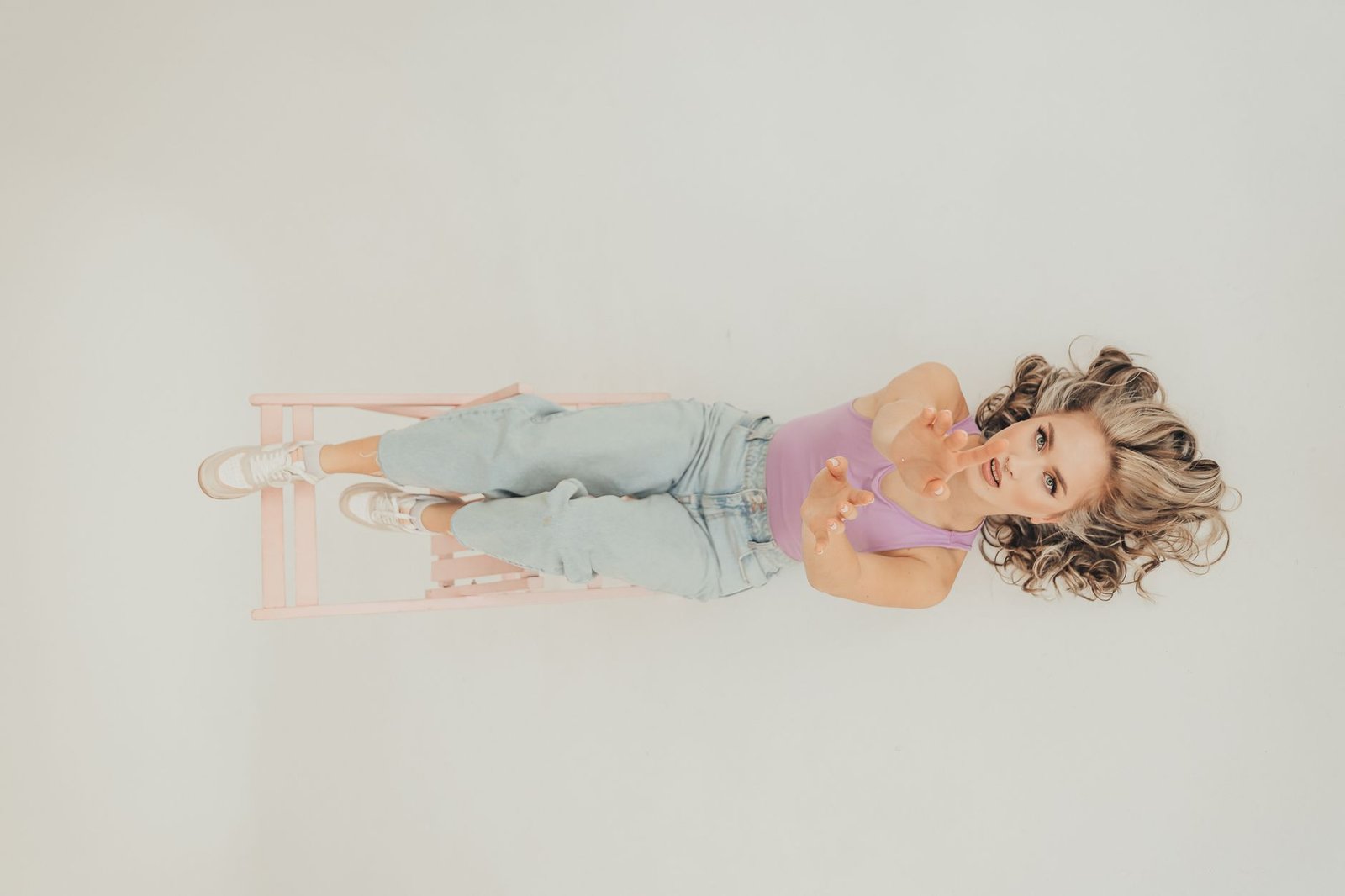 Bright pink jeans neutral top women fashion casual editorial look