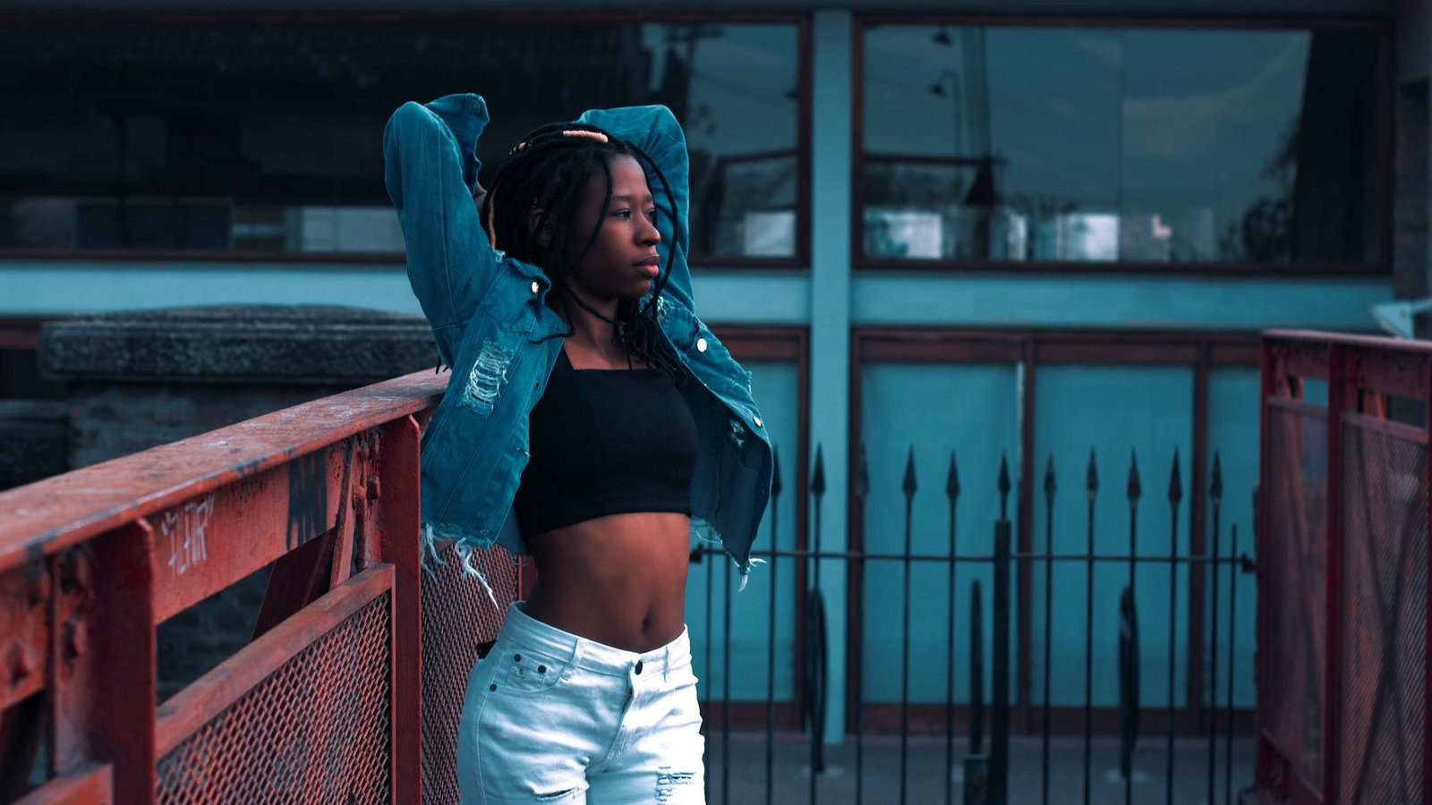 Crop top layered under denim jacket casual fashion