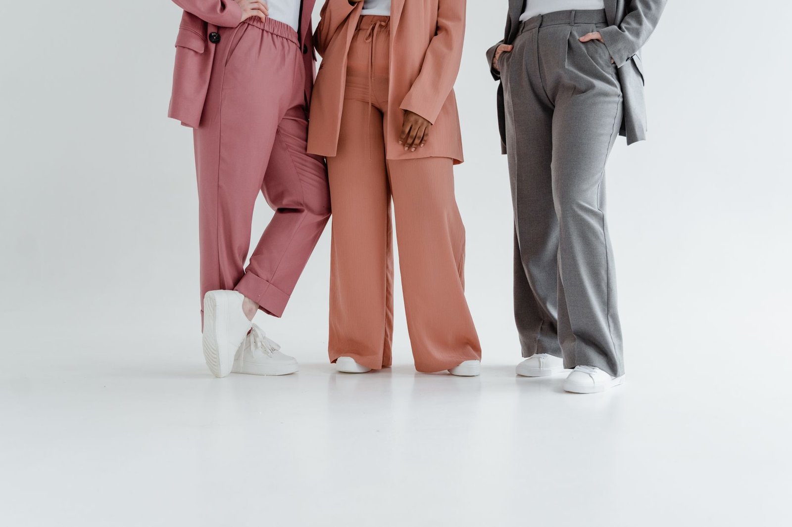 Chunky white trainers tailored trousers smart casual fashion