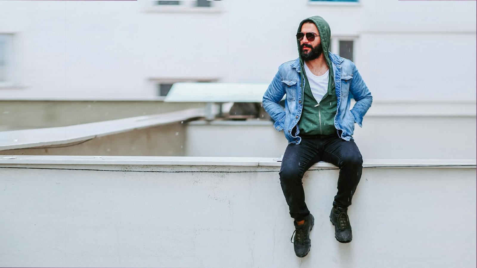 Denim jacket over hoodie streetwear layering