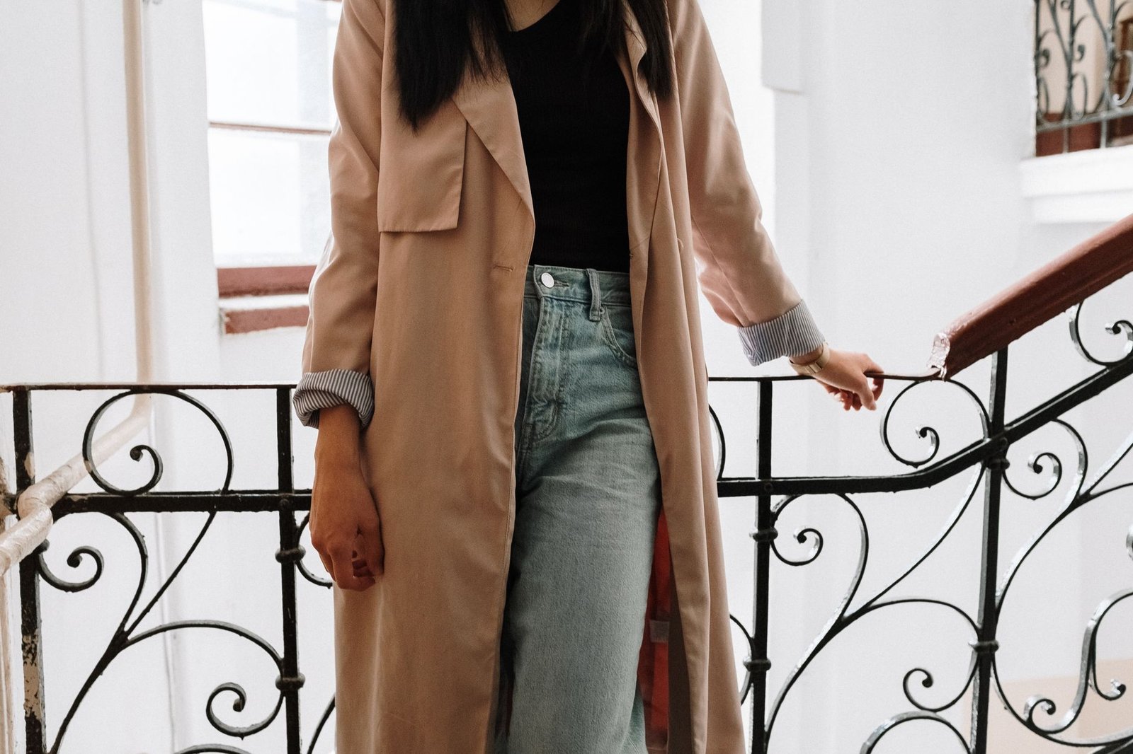 Trench coat with denim jeans casual look
