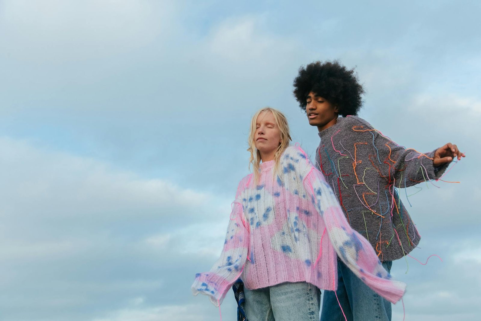 Pastel gradient knitwear styled with light wash denim