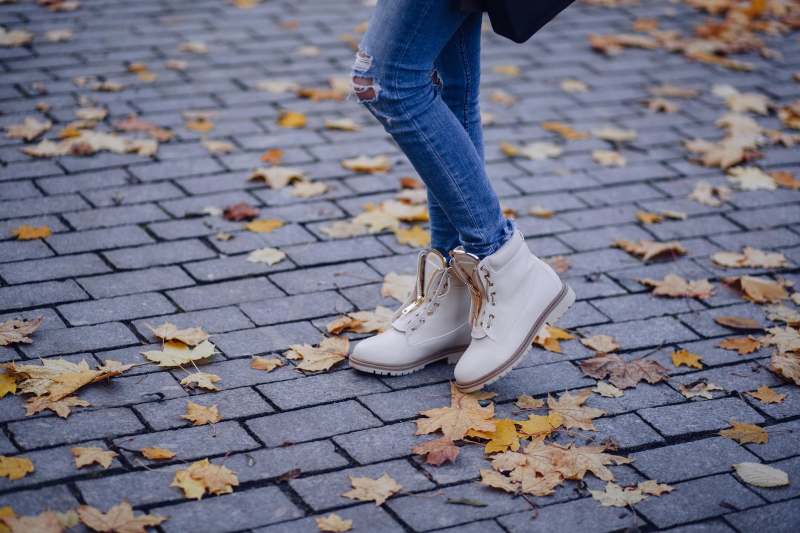 Ripped denim and combat boots punk street style