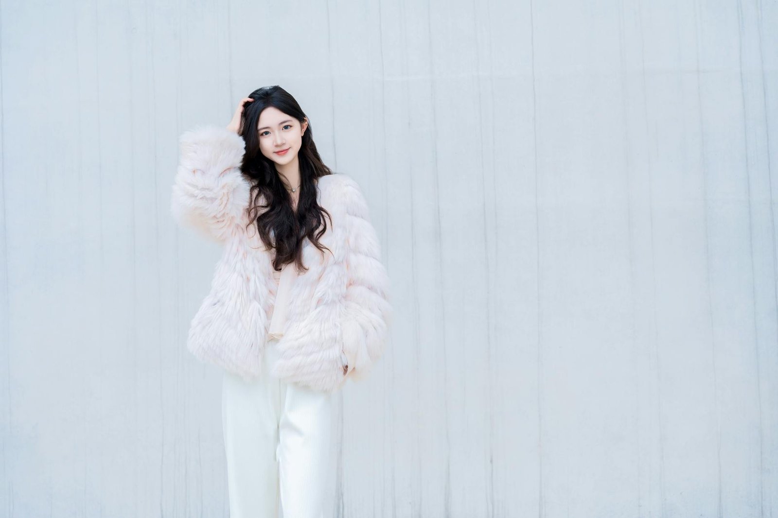 Soft girl aesthetic outfit in pastel pink with plush textures