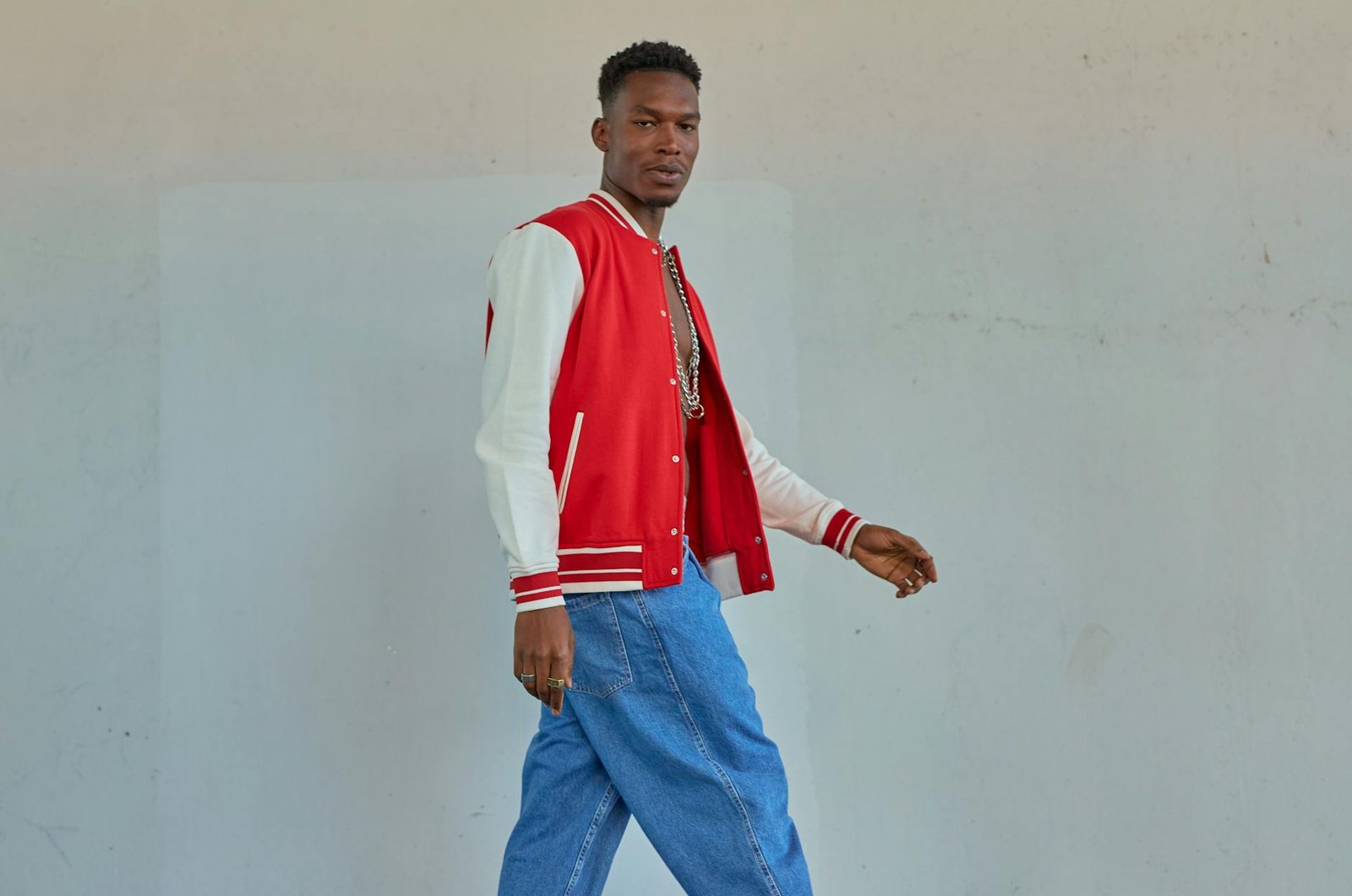 Varsity jacket straight jeans retro trainers tomboy style