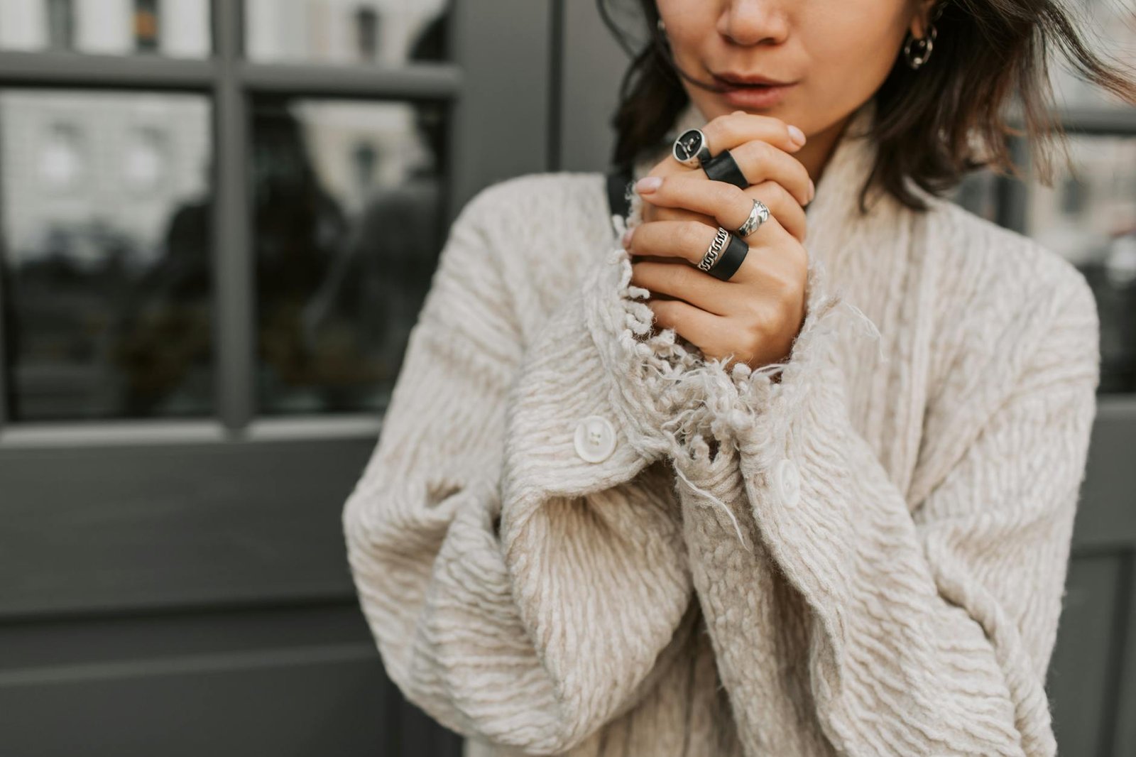 Layered winter fashion coat knitwear street style 2026