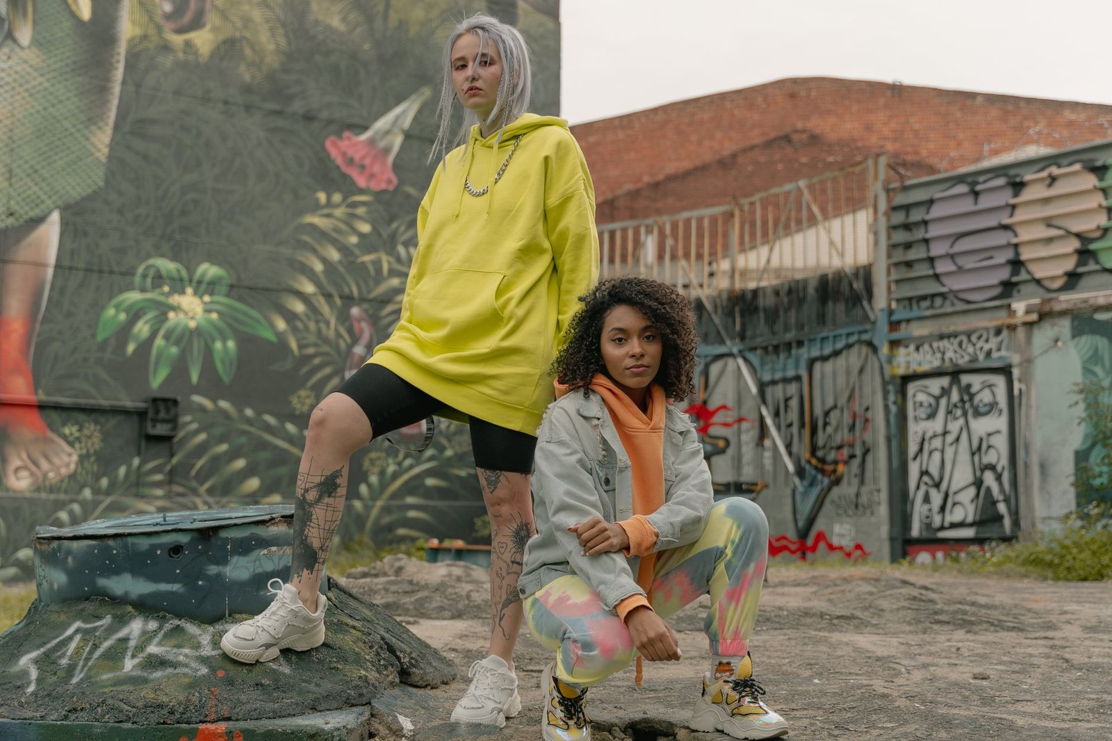 Women's streetwear outfit with oversized hoodie and mini skirt